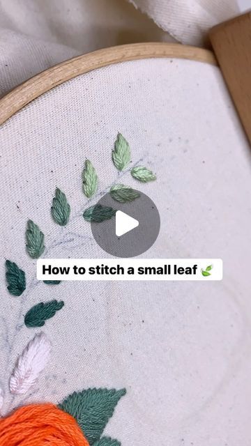 an embroidery project with the words how to stitch a small leaf on it and orange yarn