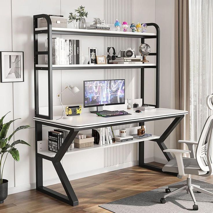 a desk with a computer on top of it in front of a book shelf filled with books