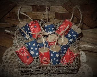 red, white and blue wrapped candles in a basket