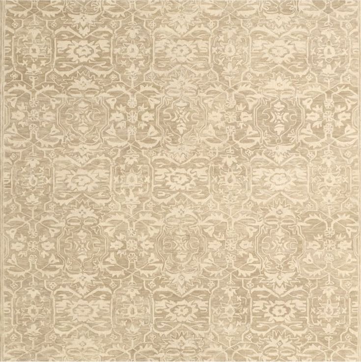 a beige rug with an intricate design on it