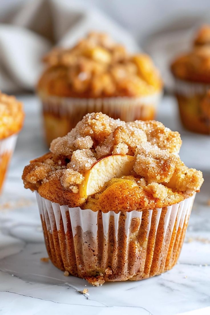 some muffins are sitting on a marble table