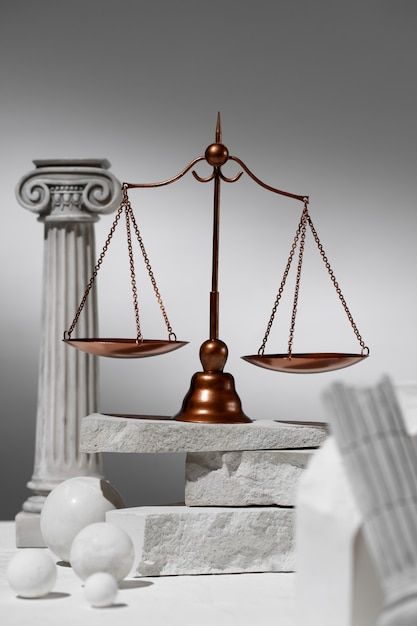 the scale of justice is shown in front of some balls