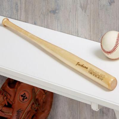 a baseball bat and ball sitting on top of a shelf next to a catchers mitt