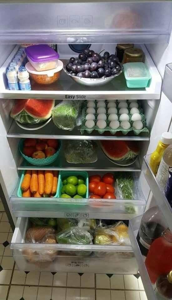 an open refrigerator filled with lots of food