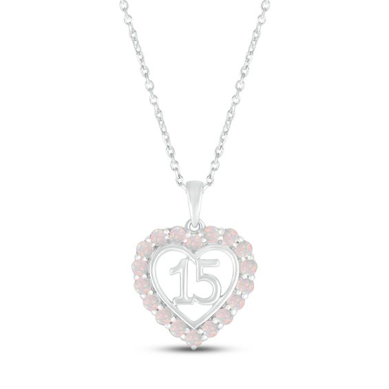 A stunning surprise for the birthday girl, this 10K white gold Quinceañera necklace features a heart with the number 15 at the center. Shimmering lab-created opals trace the heart, making the necklace an ideal gift for an October birthday. The pendant sways from an 18-inch cable chain that secures with a spring-ring clasp. Pink Birthstone Necklace For Anniversary, Silver Heart Necklace With Hallmark For Birthday, White Heart Necklace For Birthday And Valentine's Day, White Heart Charm Necklace For Birthday, White Heart-shaped Jewelry For Birthday, White Heart Pendant Jewelry For Birthday, White Necklace With Heart Charm For Birthday, White Heart Pendant Necklace For Birthday, White Heart Necklace For Birthday