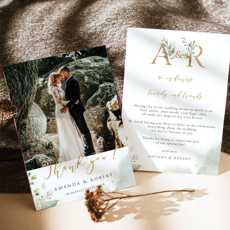 two wedding cards on top of a bed next to each other with the same photo