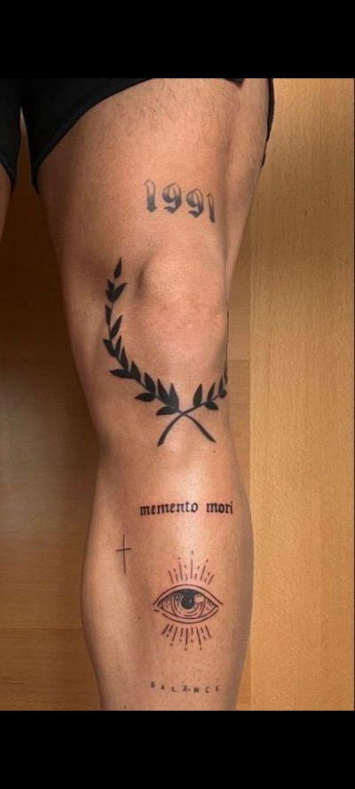 a woman's leg with tattoos on it and the words mentro mont above her