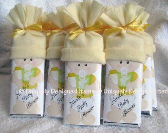 four baby shower products wrapped in yellow ribbon