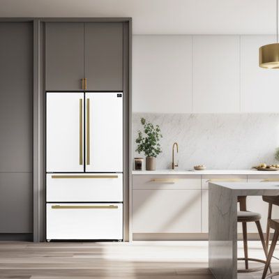 a white refrigerator freezer sitting inside of a kitchen next to a table and chairs