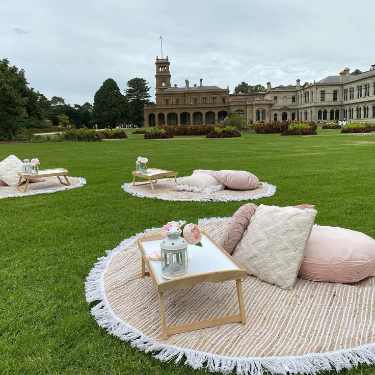 the lawn is decorated with pink and white pillows