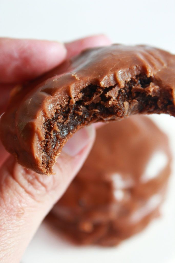 a hand holding a chocolate texas sheet cake cookie