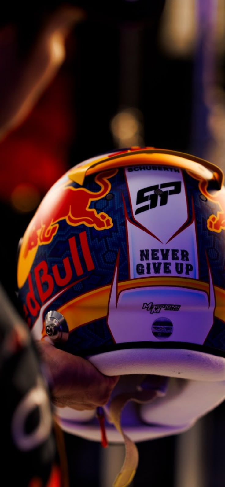 a red bull helmet hanging from the ceiling