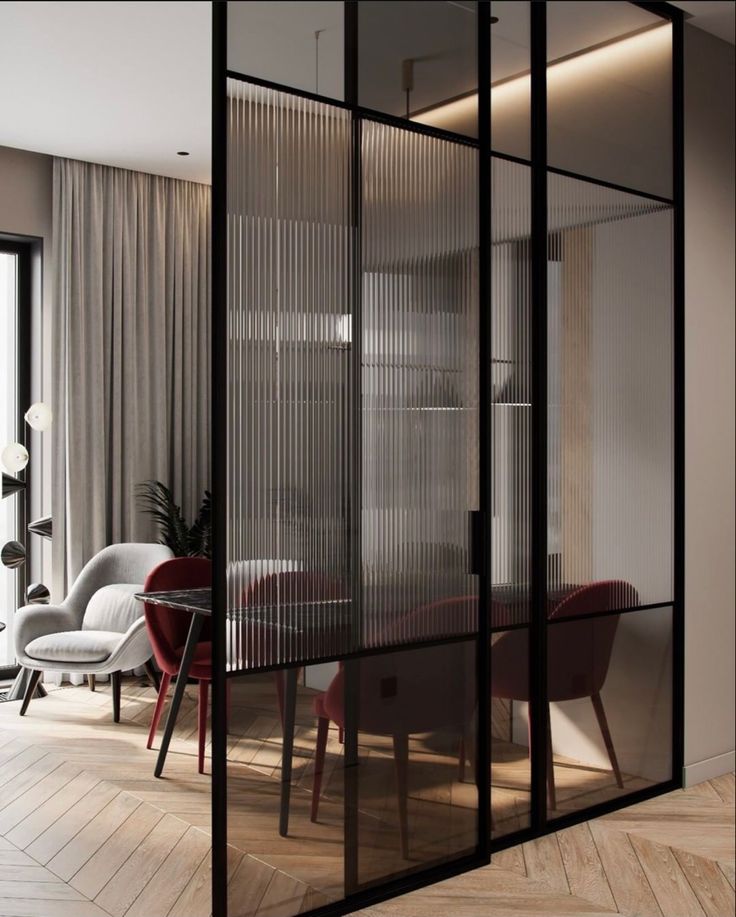 an open glass wall in the middle of a room