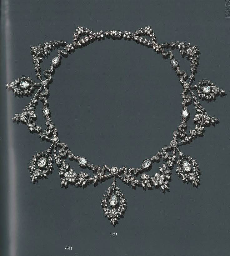 AN ANTIQUE DIAMOND GARLAND NECKLACE, CIRCA 1890. The front suspending a graduated series of five pear-shaped rose-cut diamonds, each within independent drop-shape old mine-cut garland frames, accented by old mine-cut diamond swags, joined to a similarly-set scrolling ribbon motif chain, mounted in gold and silver. Antique Diamond Necklace, Vintage Diamond Necklace, Edwardian Jewelry, Historical Jewellery, Jewelry Appraisal, Antique Necklace, Deco Jewelry, Antique Diamond, Victorian Jewelry