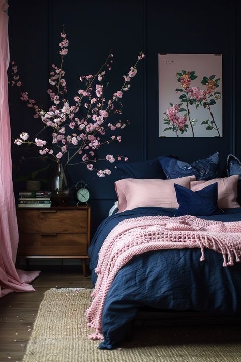 a bedroom with dark blue walls and pink flowers on the bed, along with curtains