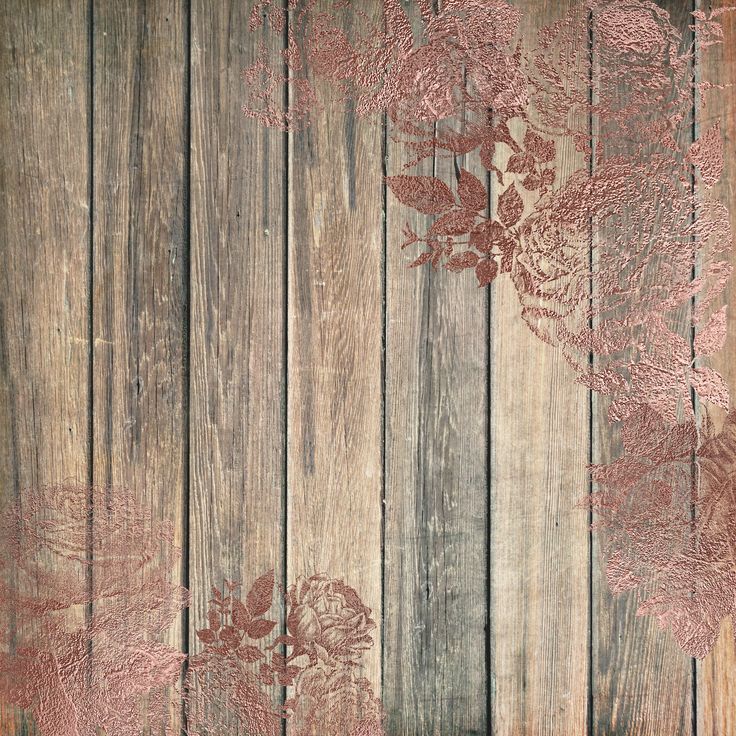 an old wooden background with red flowers on the wood planks and faded paint peeling from it