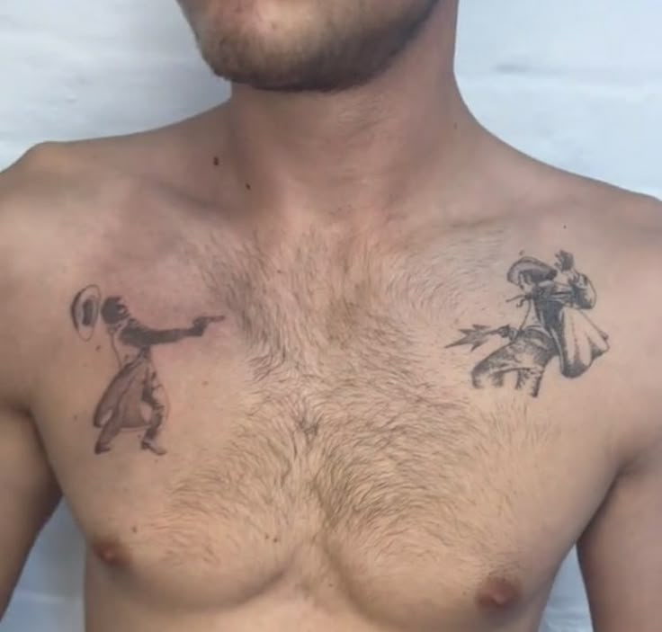 a shirtless man with tattoos on his chest