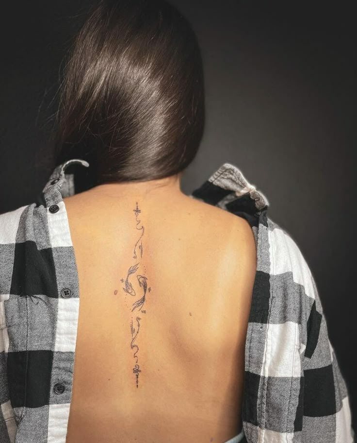 a woman with a tattoo on her back