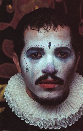 a man with painted face and white makeup