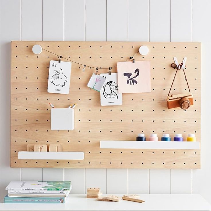 a peg board with some craft supplies on it