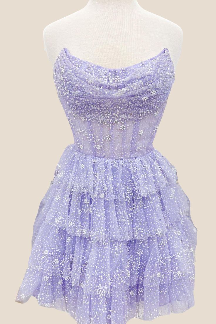 This dress features a beautiful Lavender color and is made from Tulle material, making it lightweight and airy. The A-line silhouette is flattering and the Corset bodice with strapless neck adds support and style. The skirt is designed with tiered ruffles for a playful touch, and the back zips up for convenience. Perfect for any party, this dress falls above the knee for a fun and flirty look. Classy Homecoming Dress, Short Princess Dress, Bat Mitzvah Dresses, Cute Formal Dresses, Dama Dresses, Tulle Homecoming Dress, Short Party Dress, Corset Bodice, Formal Dresses Short