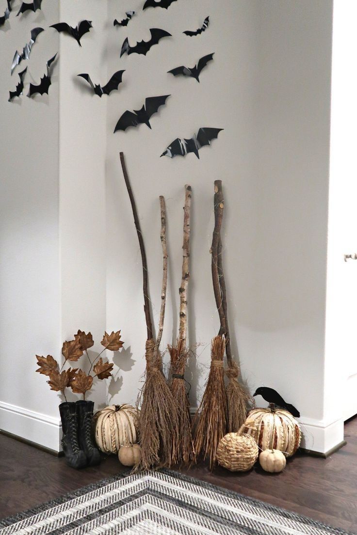 halloween decorations with bats and pumpkins on the floor