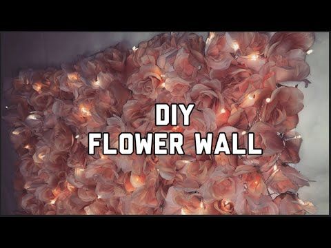 the words diy flower wall are displayed in front of a large pile of flowers