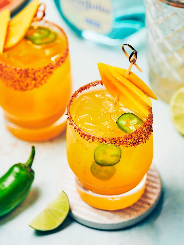 Spicy Mango Margarita - Evergreen Kitchen Spicy Mango Margarita Recipe, Drink Garnish Ideas, Mango Cocktails, Spicy Mango Margarita, Mango Festival, Evergreen Kitchen, Drink Garnish, Mango Margarita Recipe, Cocktail Recipes Tequila