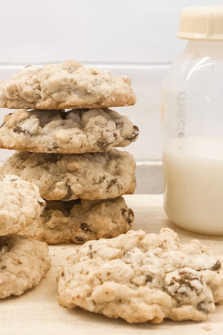 a stack of cookies next to a glass of milk