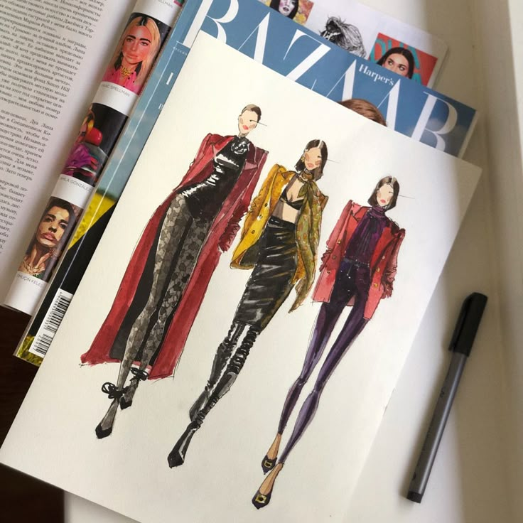 an open magazine with fashion illustrations on it