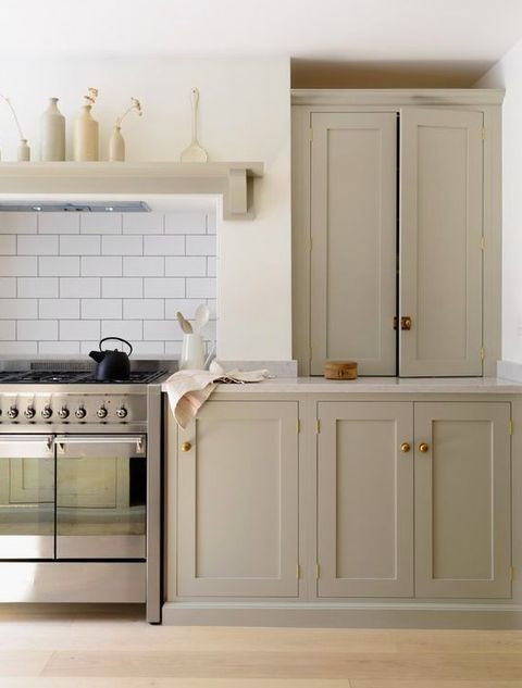 a kitchen with an oven, stove and cabinets