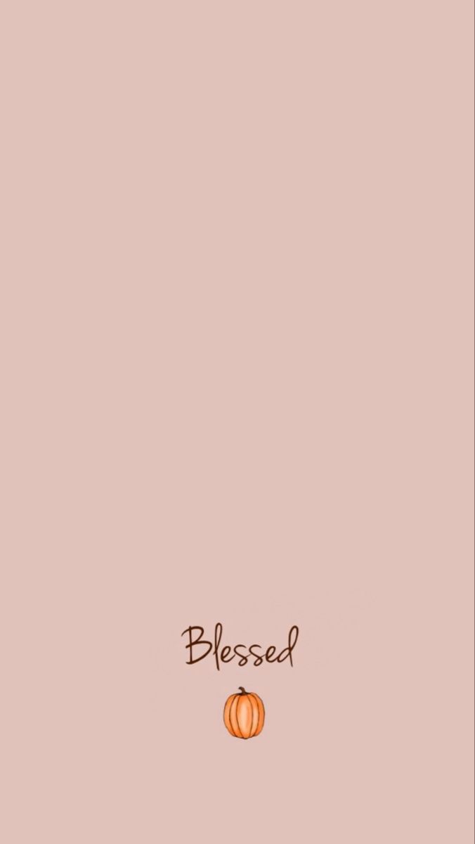 an orange pumpkin sitting on top of a pink background with the words,'blessed '