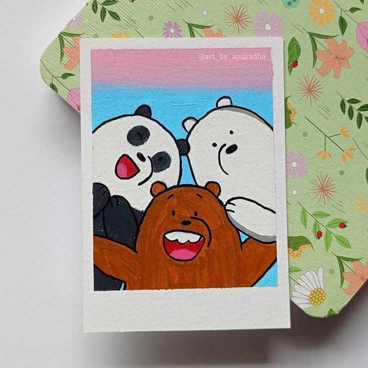 a card with two pandas and a bear on it's back, sitting next to each other