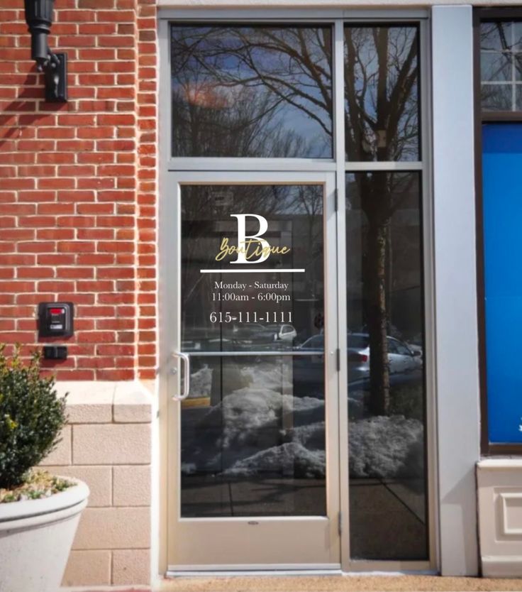 an entrance to a building with glass doors