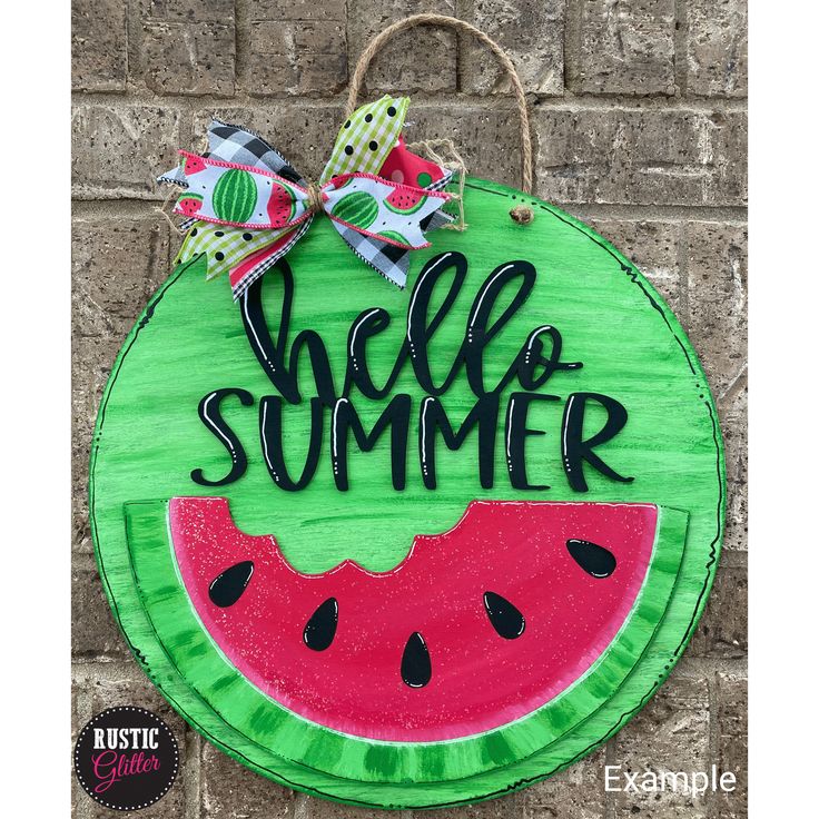 a wooden sign that says hello summer with a slice of watermelon