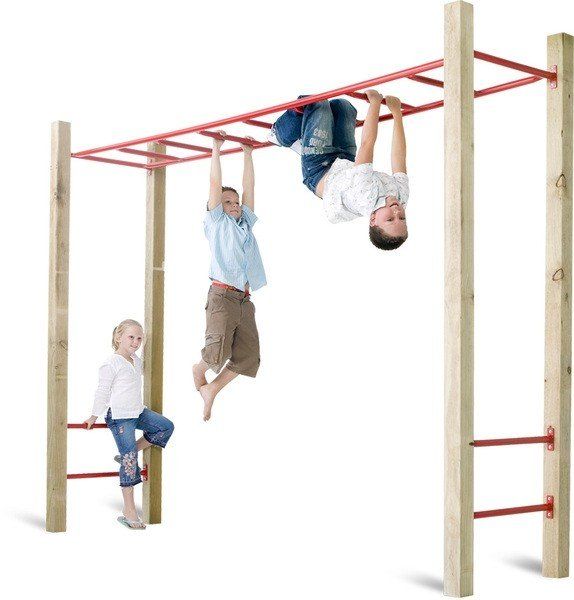 two children are playing on the monkey bars and one is hanging upside down with his hands