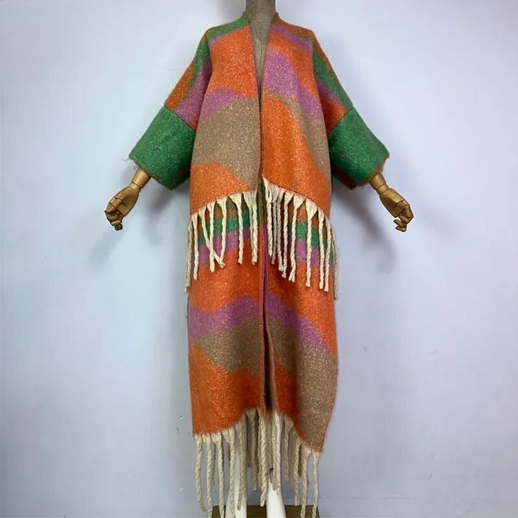 This super soft and warm wool cardigan kimono is perfect for the cold weather. Unlike other sweaters and wools, the wool used for this beauty is non itchy. Think of your favorite throw blanket, the comfort and warmth it gives but 10x stylish and wearable any where. This kimono is all that and more! One size fits S-4X Material: Wool One Size Fits Most Size Chart One Size Long Sweater For Fall, Long Multicolor Cardigan For Layering, Multicolor Long Cardigan For Layering, Wool Shawl Outerwear For Winter, Bohemian Shawl For Fall Layering, One Size Winter Acrylic Sweater Coat, One Size Acrylic Sweater Coat For Winter, Cozy Long Acrylic Outerwear, One Size Long Cardigan For Winter