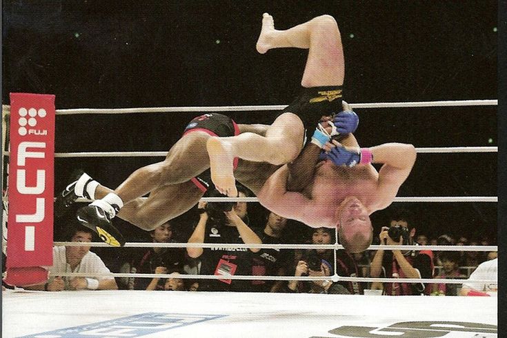 two people in the middle of a wrestling match