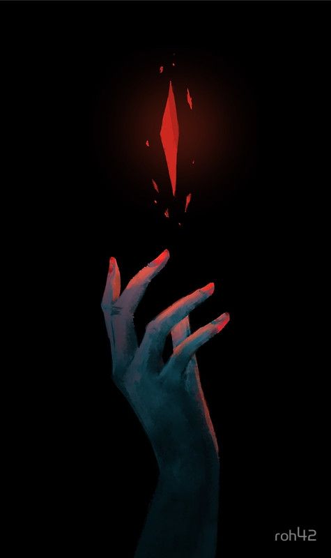 a person's hand reaching up towards a red light in the dark with their fingers