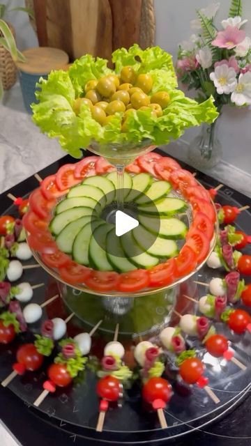 an arrangement of vegetables and fruits on a platter