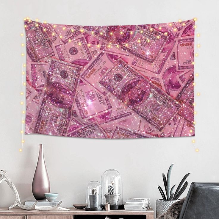 a pink wall hanging over a wooden table