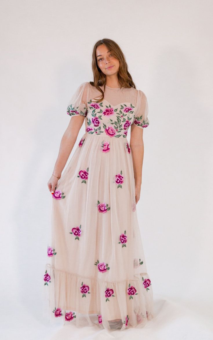 + neutral tan with colorful hand-finished floral embroidery+ subtle tulle puff sleeves+ maxi length with sweetheart neckline * Runs small, size up, if in between Spring Floral Embroidered Maxi Dress For Prom, Spring Prom Maxi Dress With Floral Embroidery, Spring Maxi Dress With Fitted Tulle Bodice, Spring Embroidered Maxi Dress For Prom, Beige Maxi Dress With Fitted Bodice For Spring, Feminine Fitted Embroidered Maxi Dress, Feminine Embroidered Fitted Maxi Dress, Floral Embellished Maxi Dress For Spring Prom, Spring Tulle Maxi Dress For Garden Party