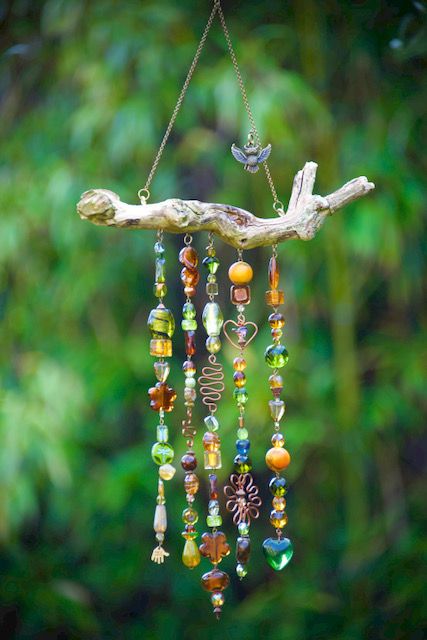 a wind chime hanging from a tree branch