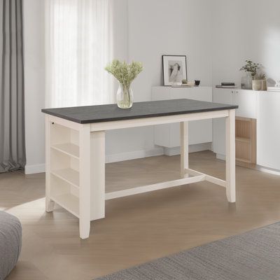 a white table with a black top in a living room