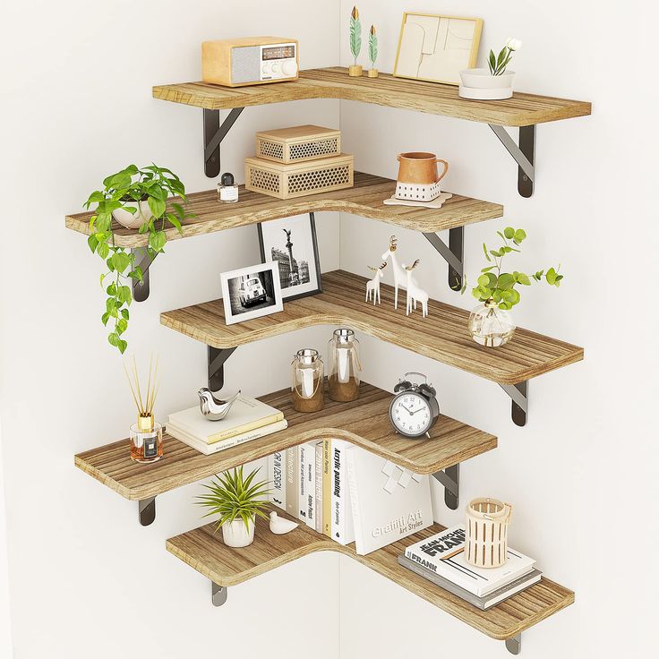 three wooden shelves with books, plants and pictures on them are arranged in the shape of hexagons