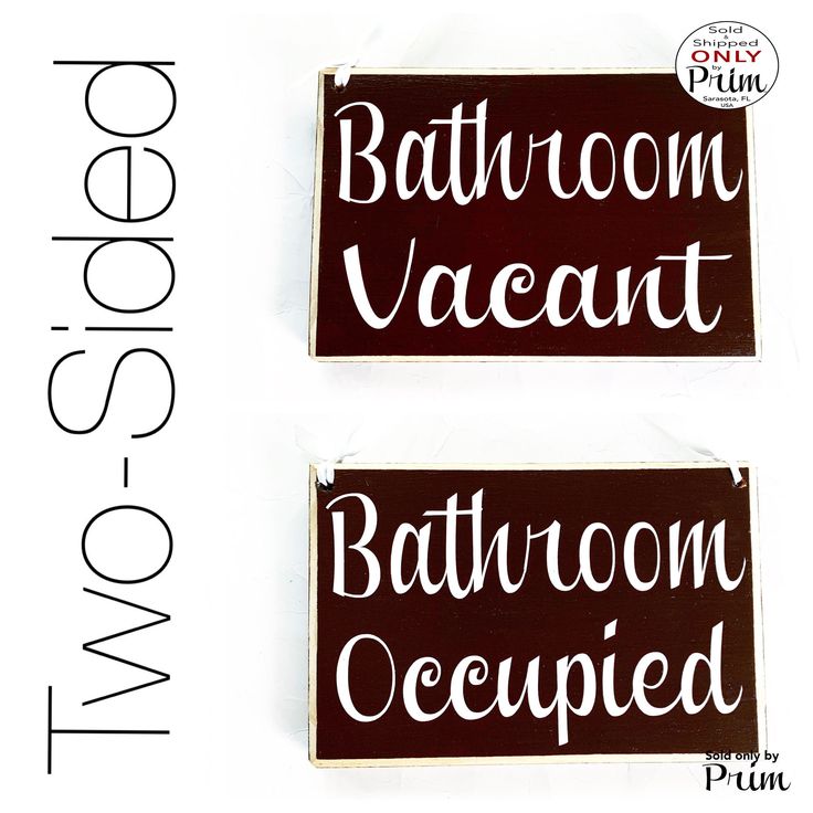 two bathroom signs with the words bath room occupied written in white ink on brown paper