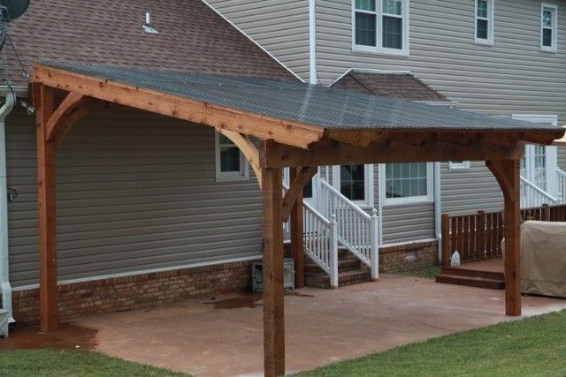 a house with a covered patio in front of it