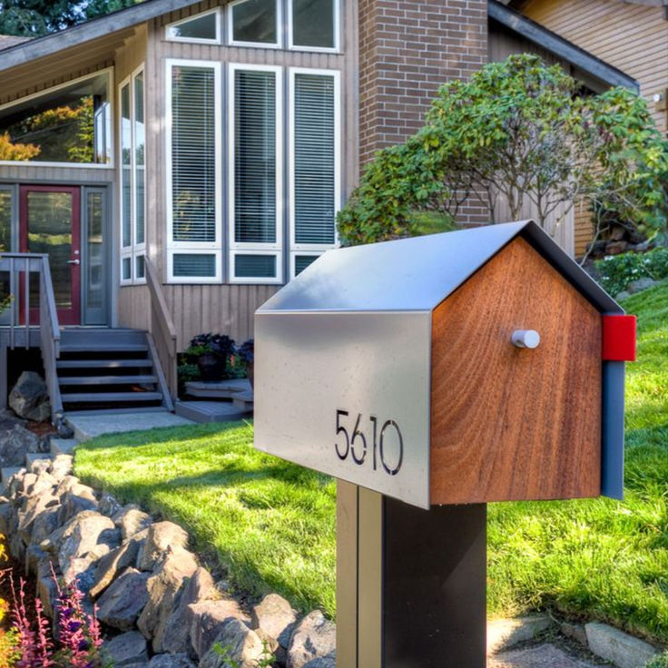 a mailbox sitting in front of a house