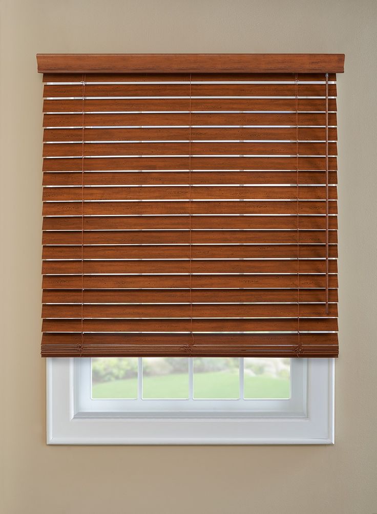 a window with wooden blinds in a room