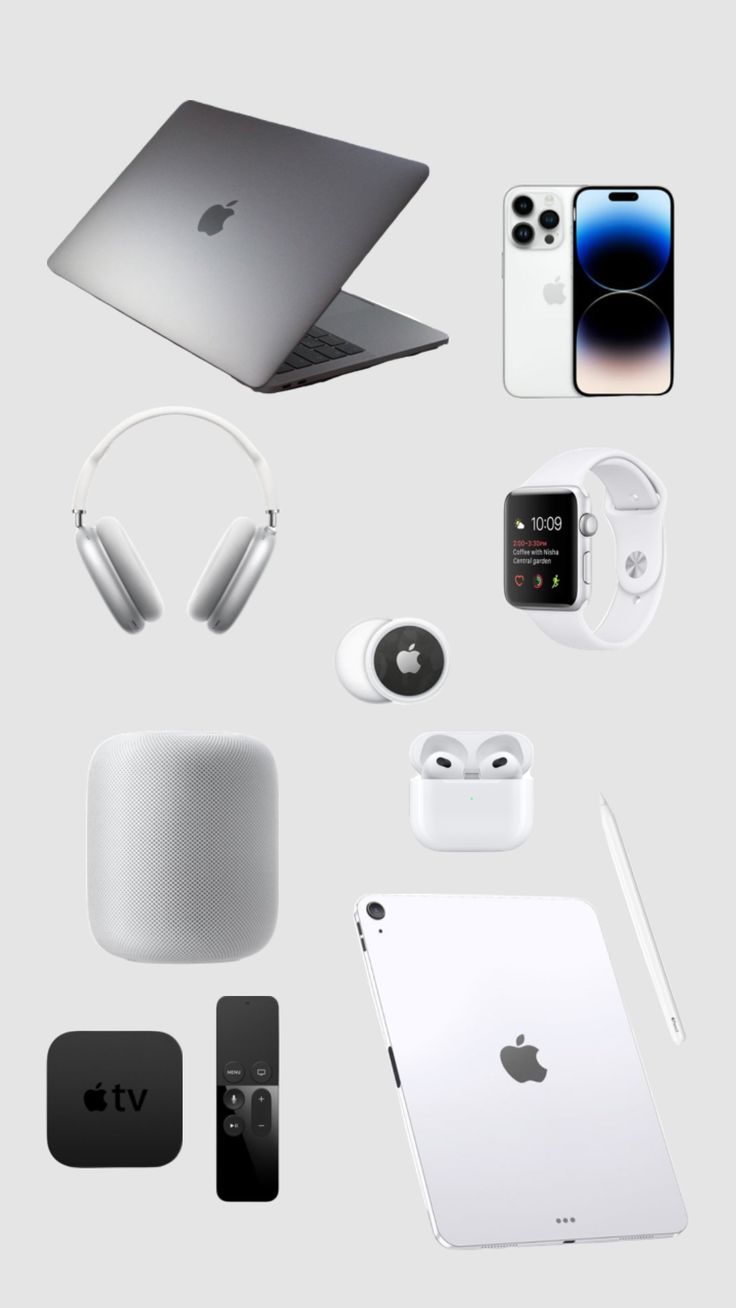 an apple laptop, headphones, and other electronics are arranged on a gray background